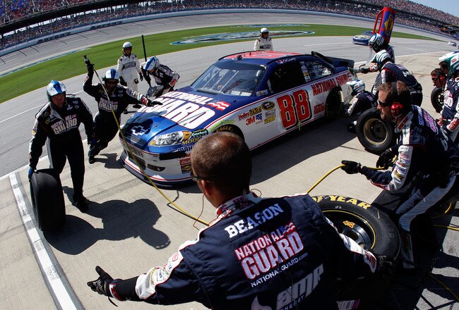 TALLADEGA, AL - APRIL 17:  Dale Earnhardt Jr., driver of the #88 National Guard/AMP Energy Chevrolet, comes in for a pit stop during the NASCAR Sprint Cup Series Aaron's 499 at Talladega Superspeedway on April 17, 2011 in Talladega, Alabama.  (Photo by Ch