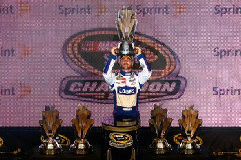 HOMESTEAD, FL - NOVEMBER 21:  Jimmie Johnson, driver of the #48 Lowe's Chevrolet, celebrates after finishing in second place in the Ford 400 to clinch his fifth consecutive NASCAR Sprint Cup championship at Homestead-Miami Speedway on November 21, 2010 in