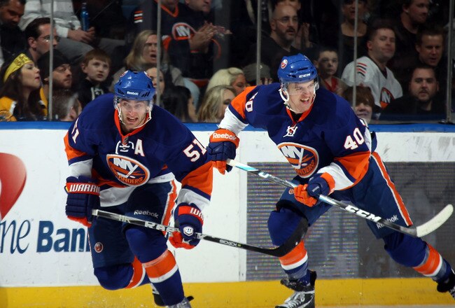UNIONDALE, NY - MARCH 11: Frans Nielsen #51 and Michael Grabner #40 of the New York Islanders skate against the Boston Bruins at the Nassau Coliseum on March 11, 2011 in Uniondale, New York.  (Photo by Bruce Bennett/Getty Images)