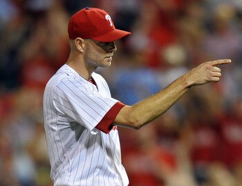 PHILADELPHIA, PA - JUNE 06: Closing pitcher Ryan Madson #46 of the Philadelphia Phillies points to catcher Carlos Ruiz #51 after getting the save during the game against the Los Angeles Dodgers at Citizens Bank Park on June 6, 2011 in Philadelphia, Pennsy