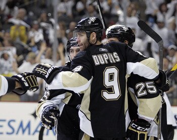 PITTSBURGH, PA - APRIL 23:  Chris Conner #16 of the Pittsburgh Penguins celebrates his third period goal with Pascal Dupuis #9 against the Tampa Bay Lightning in Game Five of the Eastern Conference Quarterfinals during the 2011 NHL Stanley Cup Playoffs at