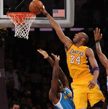 LOS ANGELES, CA - APRIL 20:  Kobe Bryant #24 of the Los Angeles Lakers goes up for a dunk over Emeka Okafor #50 of the New Orleans Hornets in Game Two of the Western Conference Quarterfinals in the 2011 NBA Playoffs on April 20, 2011 at Staples Center in