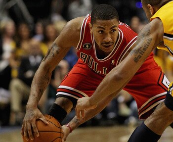 INDIANAPOLIS, IN - APRIL 23: Derrick Rose #1 of the Chicago Bulls moves against Dahntay Jones #1 of the Indiana Pacers in Game Four of the Eastern Conference Quarterfinals in the 2011 NBA Playoffs at Conseco Fieldhouse on April 23, 2011 in Indianapolis, I