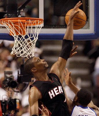 PHILADELPHIA, PA - APRIL 21: Chris Bosh #1 of the Miami Heat blocks a shot by Thaddeus Young #21 of the Philadelphia 76ers during the first half of game three of the Eastern Conference Quarterfinals at Wells Fargo Center on April 21, 2011 in Philadelphia,