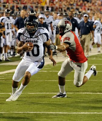 LAS VEGAS - OCTOBER 02:  Quarterback Colin Kaepernick #10 of the Nevada Reno Wolf Pack gets away from Mike Clausen #6 of the UNLV Rebel en route to scoring a touchdown in the first quarter of their game at Sam Boyd Stadium October 2, 2010 in Las Vegas, Ne
