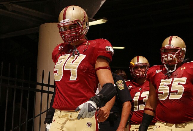 CHESTNUT HILL, MA - SEPTEMBER 04:  Mark Herzlich #94, Damik Scafe #55 and Codi Boek #13 of the Boston College Eagles walk out to the field for the home opening game against the Weber State Wildcats on September 4, 2010 at Alumni Stadium in Chestnut Hill,