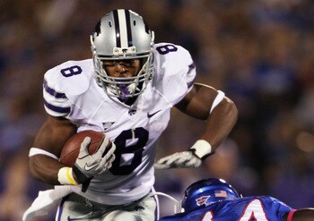 LAWRENCE, KS - OCTOBER 14:  Daniel Thomas #8 of the Kansas State Wildcats carries the ball as Olaitan Oguntodu #44 of the Kansas Jayhawks defends during the game on October 14, 2010 at Memorial Stadium in Lawrence, Kansas.  (Photo by Jamie Squire/Getty Im