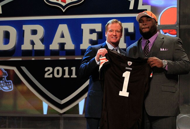 NEW YORK, NY - APRIL 28:  NFL Commissioner Roger Goodell (L) poses for a photo with Phil Taylor, #21 overall pick by the Cleveland Browns, on stage during the 2011 NFL Draft at Radio City Music Hall on April 28, 2011 in New York City.  (Photo by Chris Tro