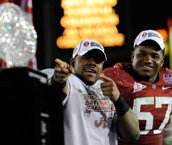 PASADENA, CA - JANUARY 07:  Running back Mark Ingram #22 and defensive lineman Marcell Dareus #57 of the Alabama Crimson Tide celebrate after winning the Citi BCS National Championship game over the Texas Longhorns at the Rose Bowl on January 7, 2010 in P