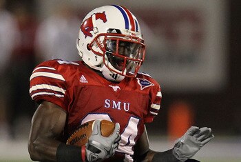 DALLAS - SEPTEMBER 24:   Wide receiver Aldrick Robinson #24 of the SMU Mustangs is tackled by Greg McCoy #7 of the TCU Horned Frogs at Gerald J. Ford Stadium on September 24, 2010 in Dallas, Texas.  (Photo by Ronald Martinez/Getty Images)