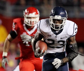 PISCATAWAY, NJ - OCTOBER 08:  Jordan Todman #23 of the Connecticut Huskies runs for a second-quarter touchdown against the Rutgers Scarlet Knights at Rutgers Stadium on October 8, 2010 in Piscataway, New Jersey.  (Photo by Jim McIsaac/Getty Images)