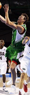 AUCKLAND, NEW ZEALAND - JULY 08:  Donatas Motiejunas of Lithuania takes the ball to the hoop as Seth Curry of the United States defends during the U19 Basketball World Championships match between the United States and Lithuania at North Shore Events Centr
