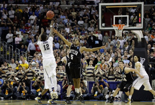WASHINGTON - MARCH 19:  Ashton Gibbs #12 of the Pittsburgh Panthers puts up a shot over Ronald Nored #5 of the Butler Bulldogs during the third round of the 2011 NCAA men's basketball tournament at Verizon Center on March 19, 2011 in Washington, DC. Butle