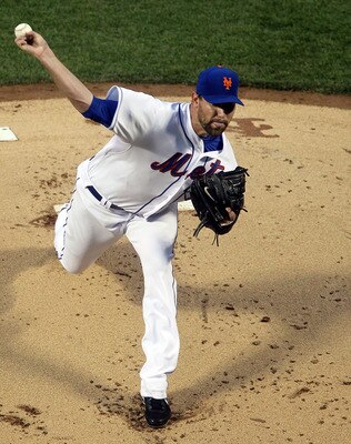 NEW YORK, NY - APRIL 11:  Mike Pelfrey #34 of the New York Mets deals a pitch against the Colorado Rockies on April 11, 2011 at Citi Field in the Flushing neighborhood of the Queens borough of New York City.  (Photo by Jim McIsaac/Getty Images)