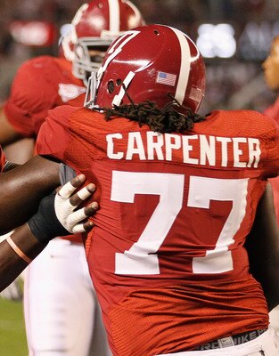 TUSCALOOSA, AL - OCTOBER 16:  Marcell Dareus #57 and James Carpenter #77 of the Alabama Crimson Tide against the Ole Miss Rebels at Bryant-Denny Stadium on October 16, 2010 in Tuscaloosa, Alabama.  (Photo by Kevin C. Cox/Getty Images)
