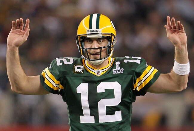 ARLINGTON, TX - FEBRUARY 06:  Quarterback Aaron Rodgers #12 of the Green Bay Packers calls out from under center against the Pittsburgh Steelers during Super Bowl XLV at Cowboys Stadium on February 6, 2011 in Arlington, Texas.  (Photo by Jamie Squire/Gett