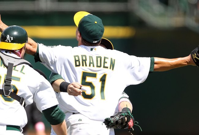 OAKLAND, CA - MAY 09:  Dallas Braden #51 of the Oakland Athletics celebrates after pitching a perfect game against the Tampa Bay Rays during an MLB game at the Oakland-Alameda County Coliseum on May 9, 2010 in Oakland, California.  (Photo by Jed Jacobsohn