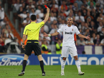 MADRID, SPAIN - APRIL 27:  Pepe of Real Madrid is sent off by Wolfgang Stark during the UEFA Champions League Semi Final first leg match between Real Madrid and Barcelona at Estadio Santiago Bernabeu on April 27, 2011 in Madrid, Spain.  (Photo by Alex Liv