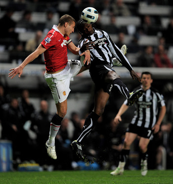 NEWCASTLE, UNITED KINGDOM - APRIL 19:  Nemanja Vidic of Manchester United goes up for a header with Nile Ranger of Newcastle United during the Barclays Premier League match between Newcastle United and Manchester United at St James' Park on April 19, 2011