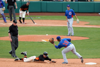 SCOTTSDALE, AZ - MARCH 01:  Gary Brown #86 of the San Francisco Giants safely steals second base under the tag from infielder Bobby Scales #19 of the Chicago Cubs during the spring training game at Scottsdale Stadium on March 1, 2011 in Scottsdale, Arizon