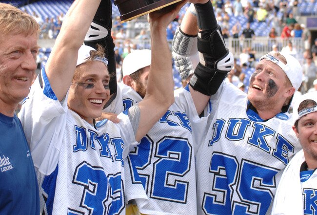 BALTIMORE, MD - MAY 31:  Head coach John Danowski, Sam Payton #32, Ned Crotty #22, Parker McKee #35, and Max Quinzani #9 of the Duke Blue Devils celebrate winning the 2010 NCAA Division 1 Lacrosse Championship against the Notre Dame Fighting Irish on May