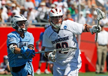 FOXBORO, MA - MAY 26:  Danny Brennan #40 of the Syracuse Orange battles Michael Evan #33 of the Johns Hopkins Blue Jays during the NCAA Lacrosse Championship at Gillette Stadium on May 26, 2008 in Foxboro, Massachusetts. Syracuse captured a 13-10 victory.