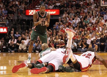 MIAMI, FL - JANUARY 04:  John Salmons #15 of the Milwaukee Bucks calls for the ball during a loose ball scrum during a game against the Miami Heat at American Airlines Arena on January 4, 2011 in Miami, Florida. NOTE TO USER: User expressly acknowledges a