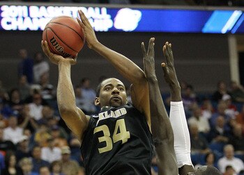 TULSA, OK - MARCH 18:  Keith Benson #34 of the Oakland Golden Grizzlies goes up for a shot against Alexis Wangmene #20 of the Texas Longhorns during the second round game of the 2011 NCAA men's basketball tournament at BOK Center on March 18, 2011 in Tuls