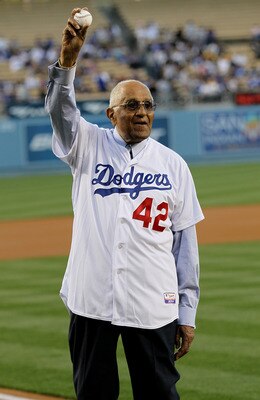 LOS ANGELES, CA - APRIL 15:   Don Newcombe, former Brooklyn Dodgers teammate of Jackie Robinson, waves before throwing out the ceremonial first pitch of the game between the Los Angeles Dodgers and the St. Louis Cardinals as Major League Baseball celebrat