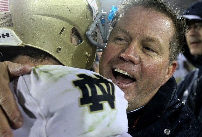 LOS ANGELES, CA - NOVEMBER 27:  Head coach Brian Kelly and quarterback Tommy Rees #13 of the Notre Dame Fighting Irish embrace after the game against the USC Trojans at the Los Angeles Memorial Coliseum on November 27, 2010 in Los Angeles, California.  No