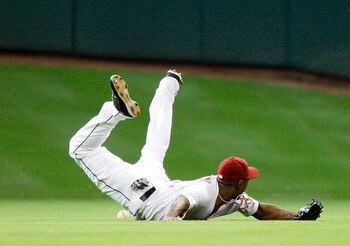 HOUSTON - MAY 11:  Center fielder Michael Bourn #21 of the Houston Astros comes up short after diving for a ball against the Cincinnati Reds at Minute Maid Park on May 11, 2011 in Houston, Texas.  (Photo by Bob Levey/Getty Images)