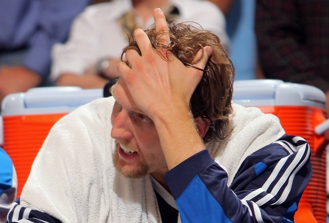 DENVER - MAY 05:  Dirk Nowitzki #41 of the Dallas Mavericks sits on the bench late in the fourth quarter against the Denver Nuggets in Game Two of the Western Conference Semifinals during the 2009 NBA Playoffs at Pepsi Center on May 5, 2009 in Denver, Col