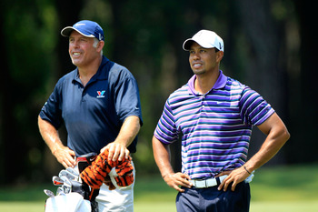 PONTE VEDRA BEACH, FL - MAY 10:  Tiger Woods (R) and caddie Steve Williams look on during a practice round prior to the start of THE PLAYERS Championship held at THE PLAYERS Stadium course at TPC Sawgrass on May 10, 2011 in Ponte Vedra Beach, Florida.  (P