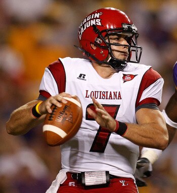 BATON ROUGE, LA - SEPTEMBER 19:  Quarterback Chris Masson #7 of the University of Louisiana-Lafatette Ragin' Cajuns looks to throw under pressure from Patrick Peterson #7 of the Louisiana State University Tigers at Tiger Stadium on September 19, 2009 in B