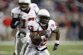 DETROIT - DECEMBER 5:  MiQuale Lewis #33 of the Ball State Cardinals runs the ball against the Buffalo Bulls during the MAC Championship game on December 5, 2008 at Ford Field in Detroit Michigan. (Photo by: Gregory Shamus/Getty Images)
