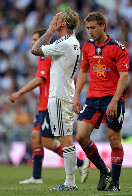MADRID, SPAIN - MAY 02:  Jose Maria Gutierrez (C) of Real Madrid reacts after failing to score during the La Liga match between Real Madrid and Osasuna at the Estadio Santiago Bernabeu on May 2, 2010 in Madrid, Spain. Real Madrid won the match 3-2.  (Phot