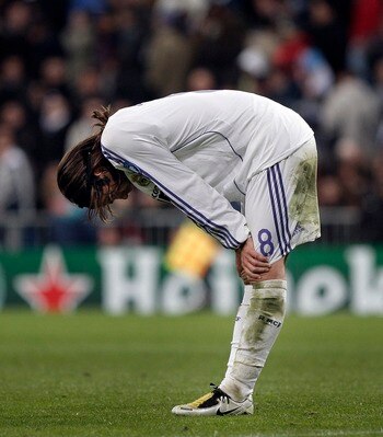 MADRID, SPAIN - MARCH 05:  Fernando Gago of Real Madrid stands dejected after conceding a goal during the UEFA Champions League first knockout round second leg match between Real Madrid and AS Roma at the Santiago Bernabeu Stadium on March 5, 2008 in Madr