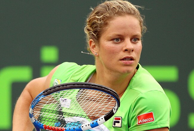 KEY BISCAYNE, FL - MARCH 29:  Kim Clijsters of Belgium runs towards the net against Ana Ivanovic of Serbia during the Sony Ericsson Open at Crandon Park Tennis Center on March 29, 2011 in Key Biscayne, Florida.  (Photo by Al Bello/Getty Images)