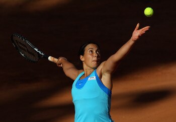 ROME, ITALY - MAY 09:  Marion Bartoli of France serves during her first round victory over Arantxa Parra Santonja of Spain during day two of the Internazionali BNL d'Italia at the Foro Italico Tennis Centre on May 9, 2011 in Rome, Italy.  (Photo by Alex L