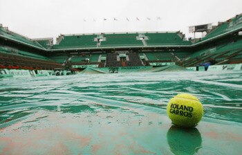 PARIS - JUNE 1:  Rain falls on the Philippe Chatrier court as play is dealyed during Day Nine of the 2004 French Open Tennis Championship at Roland Garros on June 1, 2004 in Paris, France. (Photo by Clive Mason/Getty Images)
