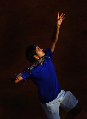 ROME, ITALY - MAY 12:  Roger Federer of Switzerland serves during his third round match against Richard Gasquet of France during day five of the Internazionali BNL d'Italia at the Foro Italico Tennis Centre on May 12, 2011 in Rome, Italy.  (Photo by Alex