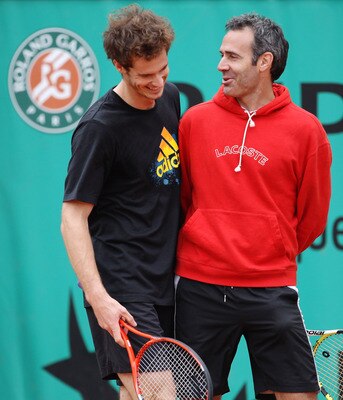 Andy Murray shares a light moment during the 2010 French Open with Paul Annacone.
