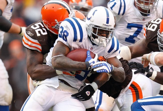 CLEVELAND - NOVEMBER 30:  D'Qwell Jackson #52 of the Cleveland Browns tackles Dominic Rhodes #38 of the Indianapolis Colts during their NFL game on November 30, 2008 at Cleveland Browns Stadium in Cleveland, Ohio. The Colts defeated the Browns 10-6.  (Pho