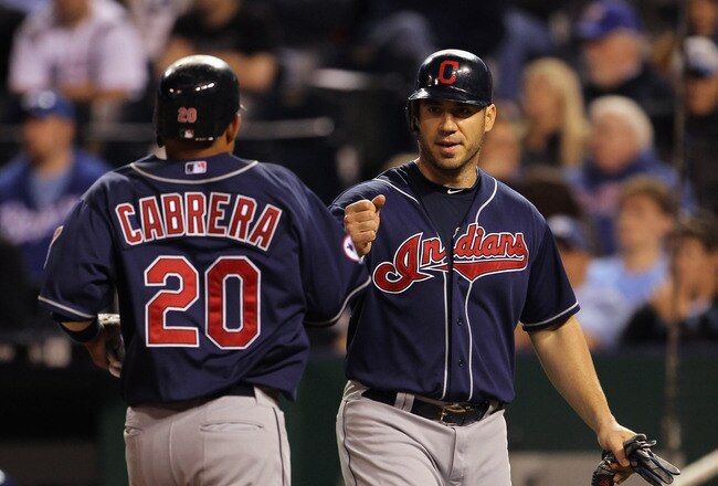 KANSAS CITY, MO - MAY 16:  Orlando Cabrera #20 of the Cleveland Indians is congratulated by Travis Hafner #48 after scoring during the game against the Kansas City Royals on May 16, 2011 at Kauffman Stadium in Kansas City, Missouri.  (Photo by Jamie Squir