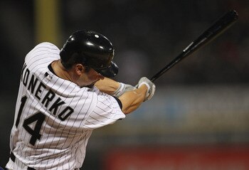 CHICAGO, IL - MAY 17: Paul Konerko #14 of the Chicago White Sox hits the ball against the Texas Rangers at U.S. Cellular Field on May 17, 2011 in Chicago, Illinois. The White Sox defeated the Rangers 4-3. (Photo by Jonathan Daniel/Getty Images)