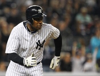 NEW YORK, NY - MAY 15:  Curtis Granderson #14 of the New York Yankees hits a two run home run in the second inning against the Boston Red Sox  during their game on May 15, 2011 at Yankee Stadium in the Bronx borough of New York City.  (Photo by Al Bello/G