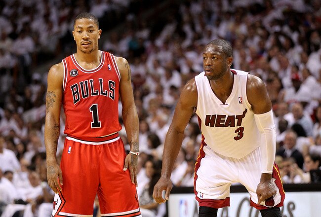 MIAMI, FL - MAY 22:  Derrick Rose #1 of the Chicago Bulls and Dwyane Wade #3 of the Miami Heat look on in Game Three of the Eastern Conference Finals during the 2011 NBA Playoffs on May 22, 2011 at American Airlines Arena in Miami, Florida.  NOTE TO USER: