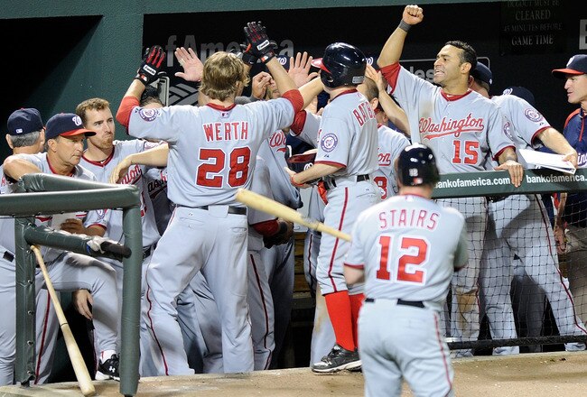 BALTIMORE, MD - MAY 20:  Jayson Werth #28 of the Washington Nationals is congratulated by teammates after hitting a home run in the fifth inning against the Baltimore Orioles at Oriole Park at Camden Yards on May 20, 2011 in Baltimore, Maryland. Washingto