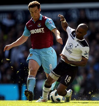 LONDON, ENGLAND - MARCH 19:  Scott Parker (L) of West Ham tangles with Jermain Defoe of Tottenham during the Barclays Premier League match between Tottenham Hotspur and West Ham United at White Hart Lane on March 19, 2011 in London, England.  (Photo by Ia