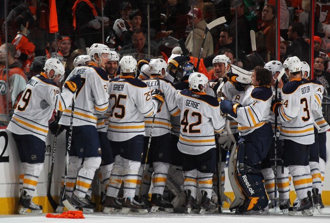 PHILADELPHIA, PA - APRIL 22:  Tyler Ennis #63 of the Buffalo Sabres celebrates with teammates after scoring the game winning goal in overtime in Game Five of the Eastern Conference Quarterfinals during the 2011 NHL Stanley Cup Playoffs at Wells Fargo Cent